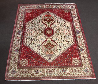 A white and plum ground North Persian rug with octagon to the centre supported by 4 birds, 264cm x 201cm 