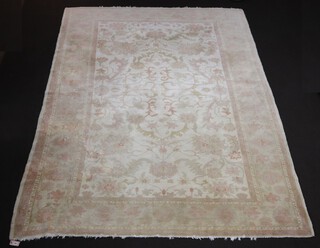 A white and green ground Caucasian style floral patterned carpet 355cm x 274cm  