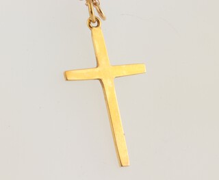 A 9ct yellow gold necklace, 43cm and a ditto cross pendant, 2 grams 