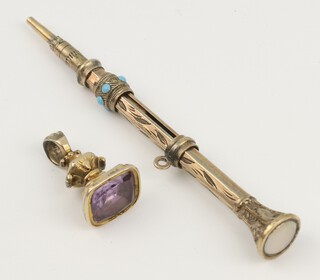 A turquoise set gilt propelling pencil and an amethyst seal 