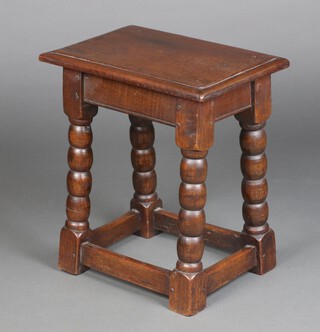 A Victorian rectangular oak joined stool raised on bobbin supports 48cm h x 43cm w x 28cm d 