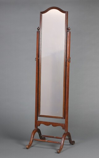 A 1930's arched plate cheval mirror contained in a mahogany swing frame 160cm h x 47cm w x 41cm d 