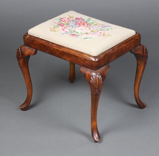 A 1930's Georgian style walnut stool with Berlin wool work drop in seat, raised on cabriole supports 47cm h x 36cm w x 33cm d 