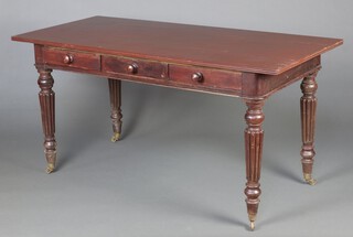 A Victorian rectangular mahogany library table fitted 3 drawers, raised on turned and reeded supports ending in brass caps casters 77cm h x 152cm w x 70cm d 