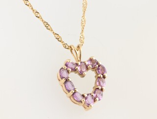 A 10ct yellow gold heart shaped pendant set with amethyst on a 9ct gold, 58cm chain, 2 grams 