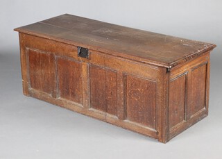 A 17th/18th Century oak coffer of panelled construction with hinged lid and iron lock 56cm  h x 145cm w x 58cm d 