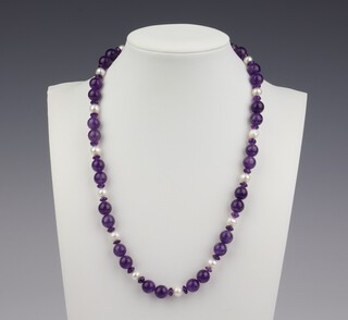 A string of amethyst beads and cultured pearls, 44cm 