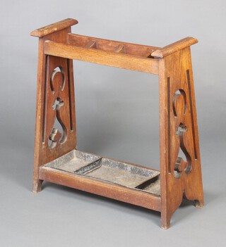 An Edwardian Art Nouveau Liberty style oak rectangular umbrella stand with pierced panels to the side, complete with drip tray, 72cm h x 68cm w x 20cm d 