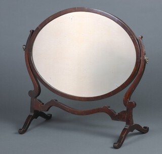 A Georgian style oval plate dressing table mirror contained in a mahogany swing frame 59cm h x 53cm w x 28cm d 