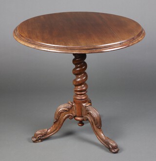 A Victorian mahogany and oak circular tea table, raised on a spiral turned oak column  with tripod base 78cm h x 80cm diam. 