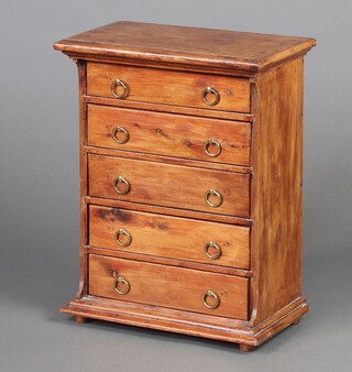 A Victorian Continental pine apprentice chest of 5 drawers with brass ring drop handles, raised on a platform base 44cm h x 34cm w x 21cm d 