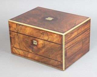 A Victorian rosewood and brass banded vanity box with hinged lid, the interior fitted 8 glass bottles with silver plated mounts and 2 secret drawers to the front and side 18cm h x 30cm w  