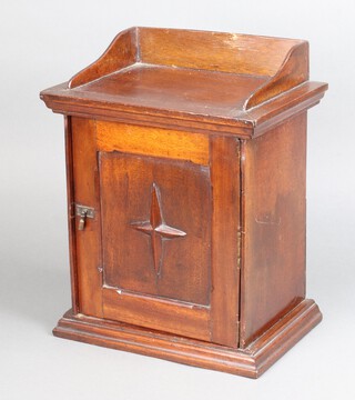 A Victorian mahogany table top cabinet with 3/4 gallery, fitted 2 short and 1 long drawers enclosed by a panelled door 36cm h x 28cm w x 20cm d 