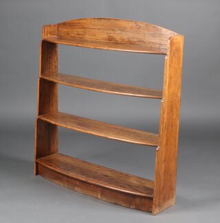 An Art Deco oak arch shaped bow front 4 tier bookcase 98cm h x 90cm x 20cm w 