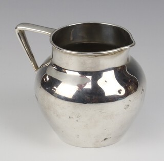 A silver globular jug with angular handle London 1911, 10cm, 210 grams 