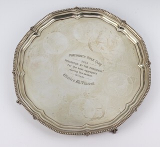 A silver salver with beaded rim and claw feet, London 1913, with presentation inscription, maker George Hindmarsh, 26cm, 464 grams 