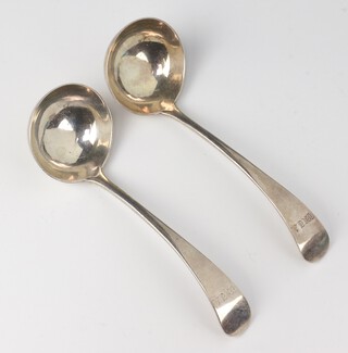 A pair of silver sauce ladles Sheffield 1912, 168 grams, engraved monogram 