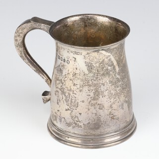 A silver mug with engraved inscription and S scroll handle London 1934, 10cm, 188 grams 