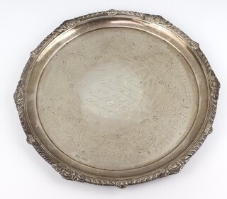 A Victorian silver salver with fluted rim and bun feet, having an engraved inscription, Sheffield 1897, 924 grams, 31.5cm 