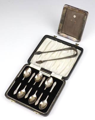 Six silver coffee spoons Birmingham 1970, a pair of sugar nips and a rectangular photograph frame 10cm weighable silver 80 grams 