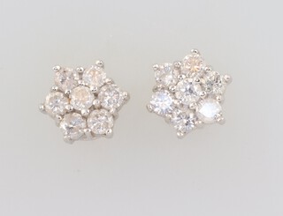 A pair of white and yellow gold, testing as 9ct, 6 stone diamond daisy ear studs, approx. 1.4ct, 2.8 grams 