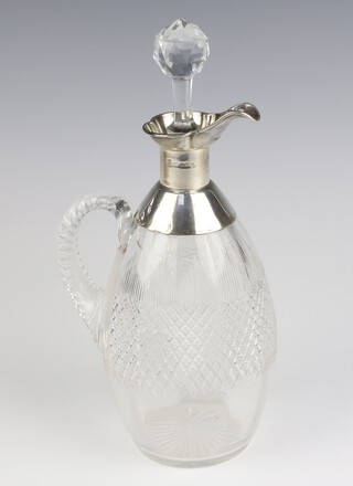 A cut glass ewer with silver spout and stopper 30cm (the hallmarks are rubbed) 