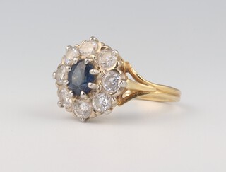 An 18ct yellow gold oval diamond and sapphire cluster ring, the centre oval stone approx. 1ct, the 8 brilliant cut diamonds approx. 1.6ct, 7 grams 