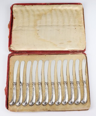 A set of 12 Edwardian pistol butt silver handled butter knives Sheffield 1910, cased