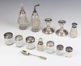 A silver mounted toilet jar Birmingham 1910 and 9 other mounted items, a pair of dwarf candlesticks and a spoon, weighable silver 54 grams 