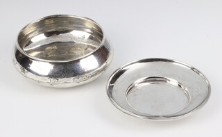 An Asprey silver dish London 1916, 12cm, together with an Egyptian white metal bowl engraved with a river scape 12cm, 118 grams 