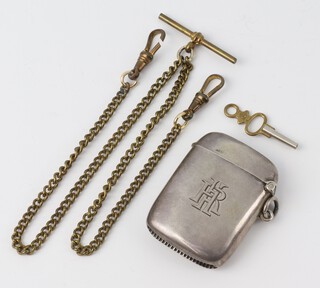 A silver vesta with engraved monogram Birmingham 1912 gross weight 29 grams and a brass Albert