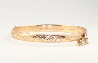 A 9ct yellow gold engraved bangle, 20.5 grams 