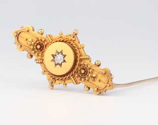 An Edwardian 15ct yellow gold Etruscan style brooch set with a brilliant cut diamond, approx. 0.20ct, 46mm, 5.6 grams gross 