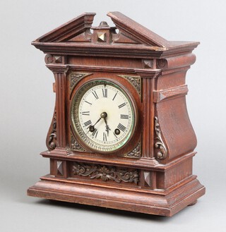 An Edwardian striking mantel clock with 10cm silvered dial, Arabic numerals, contained in an oak case, complete with pendulum and key  31cm h x 25cm w x 14cm d 