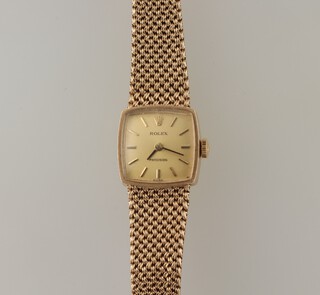 A lady's 9ct yellow gold Rolex wristwatch and mesh bracelet contained in a 15mm case, 25 grams including glass, with original box, guarantee, 1972 receipt, booklet and outer box 