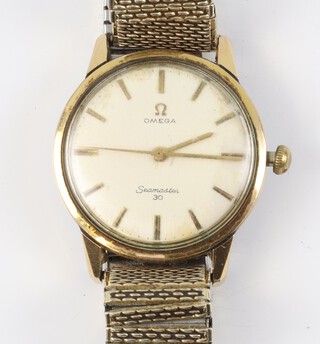 A gentleman's vintage gilt cased Omega Seamaster 30 wristwatch contained in a 32mm case, on a later gilt bracelet 