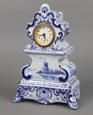 A Continental timepiece with paper dial, Arabic numerals, contained in a Delft blue and white arch shaped case 27cm h x 19cm w x 9cm  