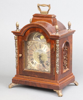 Warmink, a bracket clock having a 9cm silvered dial with phases of the moon and silvered chapter ring, contained in a walnut and gilt finished case 20cm h x 17cm w x 13cm d 