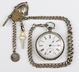 A silver key wind pocket watch in a 47mm case with key, together with a silver Albert, fob and 2 coins, gross weight excluding watch 60 grams 