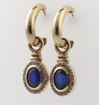 A pair of 9ct yellow gold sapphire and diamond earrings, for pierced ears, 32mm, the treated sapphires 1ct each, 7.9 grams 