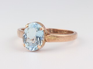 A yellow gold, testing as 9ct, oval topaz ring, size O, 2.2 grams 