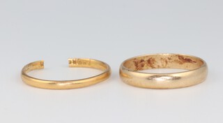 A 9ct yellow gold wedding band size M, 1.8 grams, together with a 22ct ditto (cut) 1.5 grams 