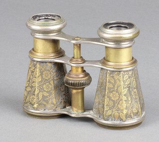 A pair of 19th Century opera glasses contained in a floral engraved gilt metal case 