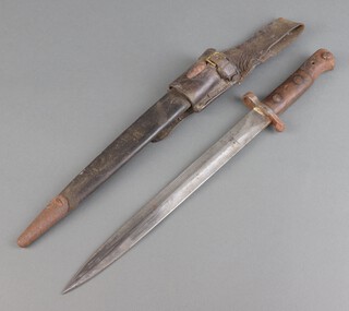 An 1888 patent Lee Mitford Mk1 bayonet, the blade dated 1903 with Royal Cypher marked EFD complete with scabbard 