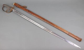 An Officer's Royal Artillery sword, the blade etched Royal Artillery and numbered 1000325, complete with leather scabbard