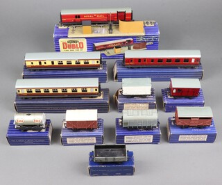 A Hornby Dublo T.P.O mail van train set boxed, 3 Hornby Dublo carriages - 1 x D21 and 2 x D22, 7 items of rolling stock, all boxed 