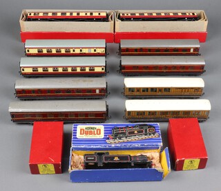 A collection of Hornby Dublo and O gauge train rolling stock contained in 2 plastic boxes 