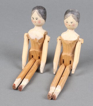 Two 19th/20th Century wooden peg dolls with articulated limbs 17cm 