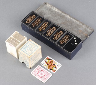 Pigmy, Thomas de la Rue, a double set of miniature playing cards (slight damage to the side of the box) together with 24 Wills Capstan's cigarettes dominoes in a metal case (dents to case)