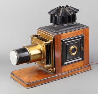 A 19th Century brass and mahogany magic lantern 39cm x 45cm x 21cm converted to electricity (to be used for decorative purposes only) 